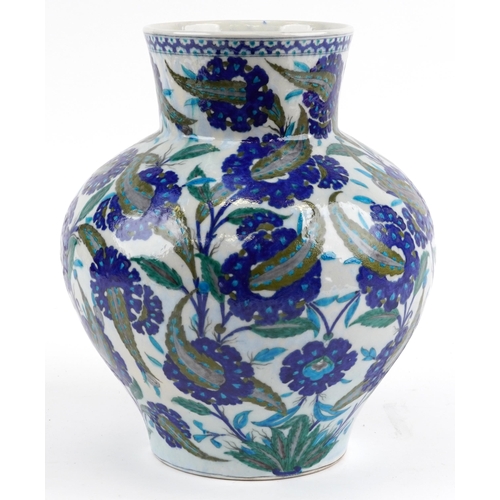 91 - Large Turkish Ottoman Iznik pottery vase hand painted with flowers amongst foliage, 39cm high