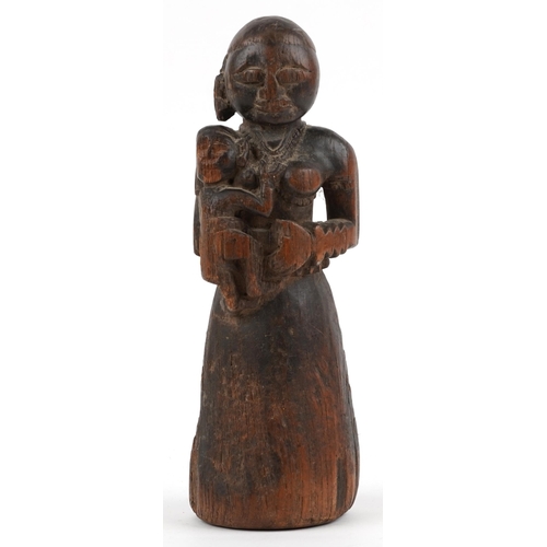 411 - African tribal interest carved wood maternity  figure of mother and child, 29.5cm high