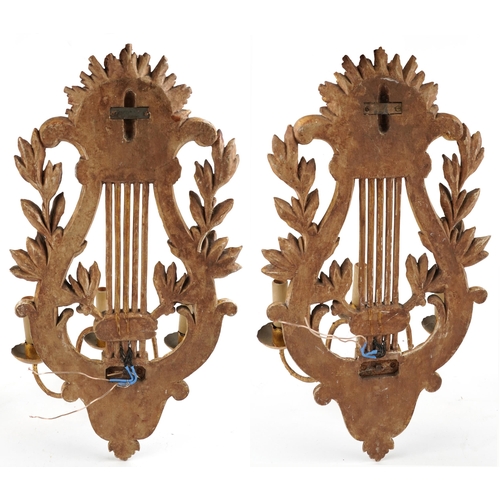 177 - Pair of 19th century French gilt wood three branch wall sconces in the form of a lyres, each 61cm hi... 