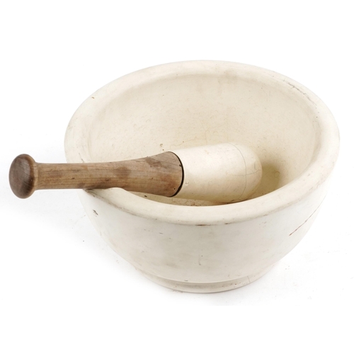 2718 - Large stone pestle and mortar, impressed marks to the mortar, the mortar 28.5cm in diameter