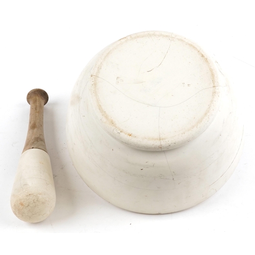 2718 - Large stone pestle and mortar, impressed marks to the mortar, the mortar 28.5cm in diameter