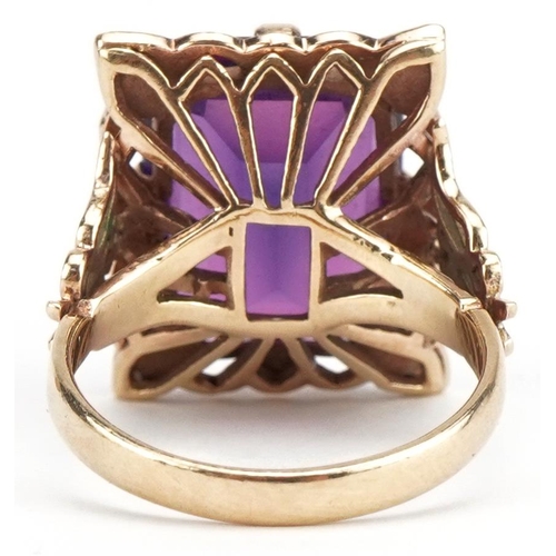 48 - Large 9ct gold alexandrite ring with pierced butterfly shoulders, the stone approximately 16.20mm x ... 