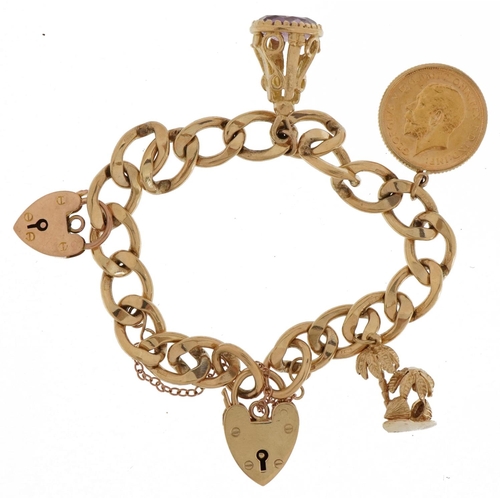 24 - 9ct gold charm bracelet with three gold charms and two 9ct gold love heart padlocks including a Geor... 