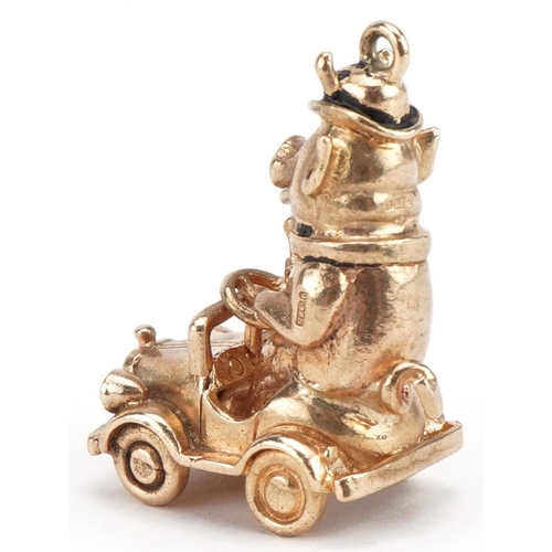 18 - 9ct gold and enamel comical pig driving a car charm, 2.8cm high, 10.0g