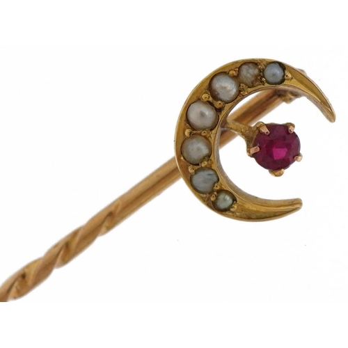 498 - Victorian unmarked gold ruby and seed pearl moon crest stickpin, tests as 15ct gold, housed in a Joh... 