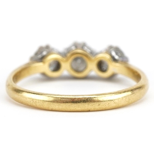 20 - 18ct gold diamond three stone ring, total diamond weight approximately 1.45 carat, size U, 4.5g