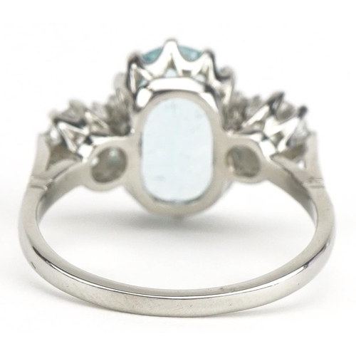 25 - Unmarked white gold aquamarine and diamond three stone ring, tests as 18ct gold, total diamond weigh... 