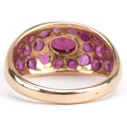 44 - 14ct gold ruby ring set with twenty three rubies, size M/N, 4.1g