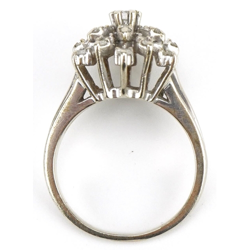 31 - 14ct white gold diamond three tier flower head ring, size M, 5.2g