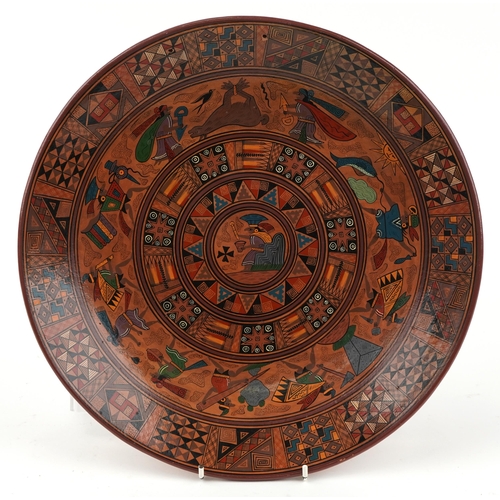 2650 - Peruvian terracotta charger hand painted with mythical figures and animals, inscribed Chinchero Cusc... 