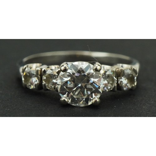 10 - White gold diamond five stone ring, indistinct marks, possibly 14k, the central diamond approximatel... 