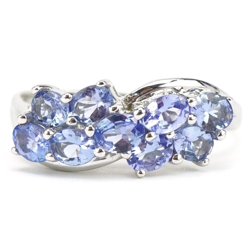 54 - 9ct white gold tanzanite crossover ring, size S, 3.0g