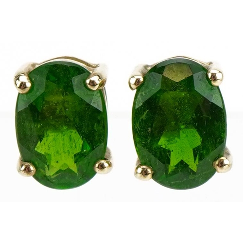 59 - Pair of 9ct gold green stone solitaire stud earrings, possibly green amethyst, 7mm high, 0.8g