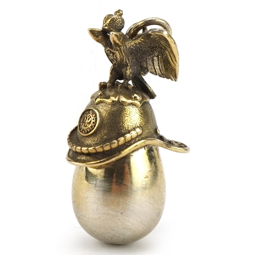 501 - Silver gilt Russian helmet egg pendant, impressed Russian marks to the suspension loop, 4.5cm high, ... 