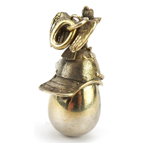501 - Silver gilt Russian helmet egg pendant, impressed Russian marks to the suspension loop, 4.5cm high, ... 