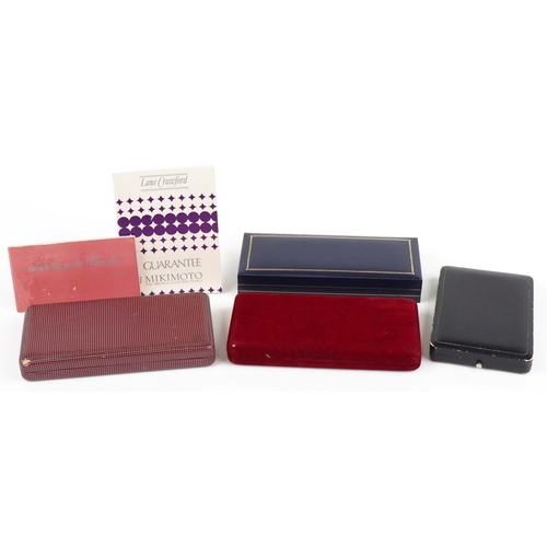 564 - Four Mikimoto pearl jewellery boxes and two leaflets, the largest 20.5cm in length