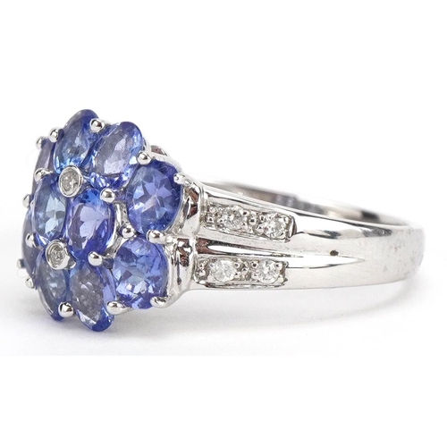 29 - 14ct white gold iolite and diamond flower head ring, size N, 3.1g