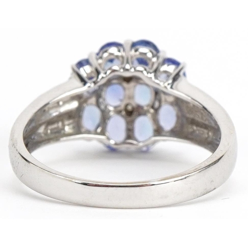 29 - 14ct white gold iolite and diamond flower head ring, size N, 3.1g