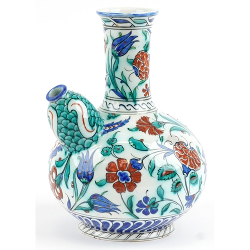 278 - Turkish Iznik pottery kendi hand painted with stylised flowers, 27.5cm high