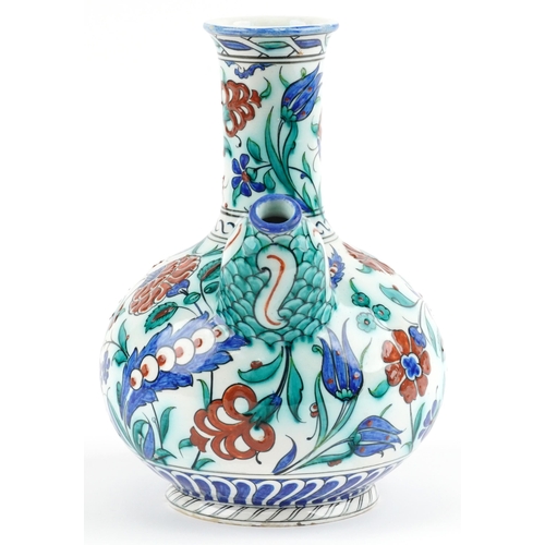 278 - Turkish Iznik pottery kendi hand painted with stylised flowers, 27.5cm high