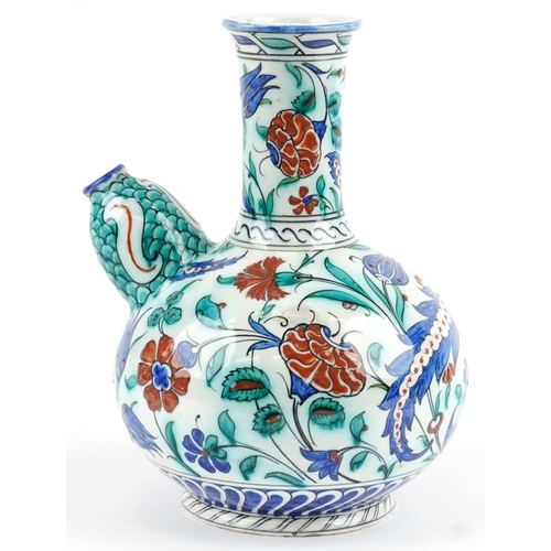 278 - Turkish Iznik pottery kendi hand painted with stylised flowers, 27.5cm high