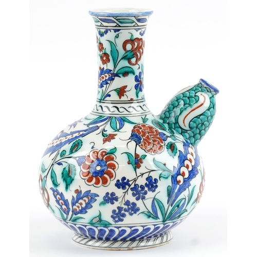 278 - Turkish Iznik pottery kendi hand painted with stylised flowers, 27.5cm high