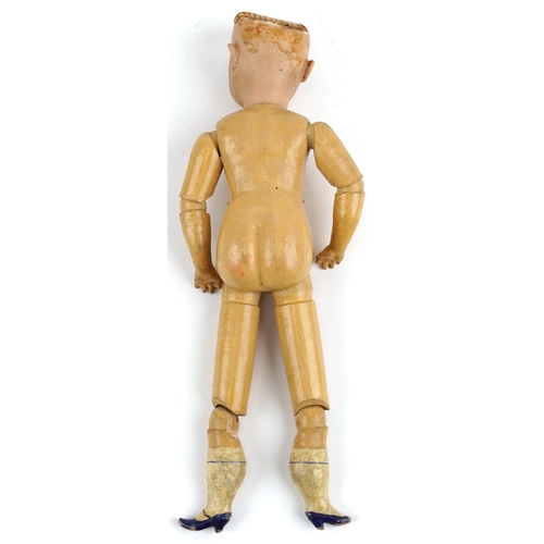 1155 - 19th century German bisque headed doll with jointed wooden limbs, indistinct marks to the back of th... 