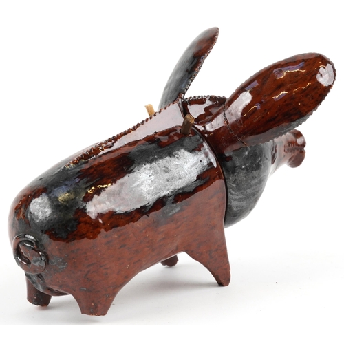 508 - Antique naive treacle glazed two section pottery pig, 20.5cm in length