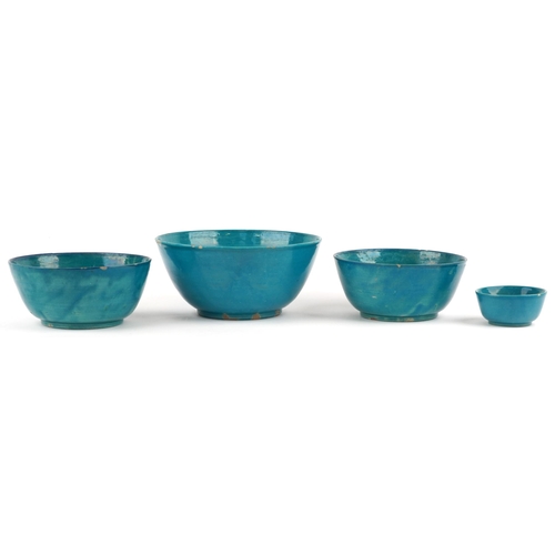 591 - Four Chinese porcelain bowls having turquoise glazes including a pair, the largest 23cm in diameter