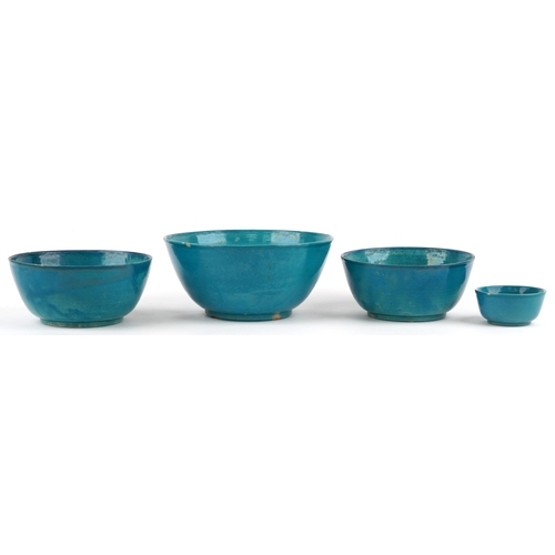 591 - Four Chinese porcelain bowls having turquoise glazes including a pair, the largest 23cm in diameter