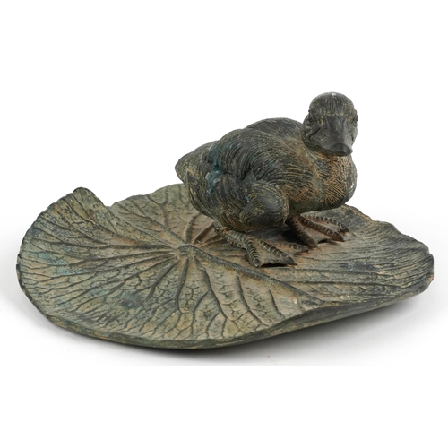 483 - Verdigris patinated bronze sculpture of a duckling on lily pad, 23cm in length