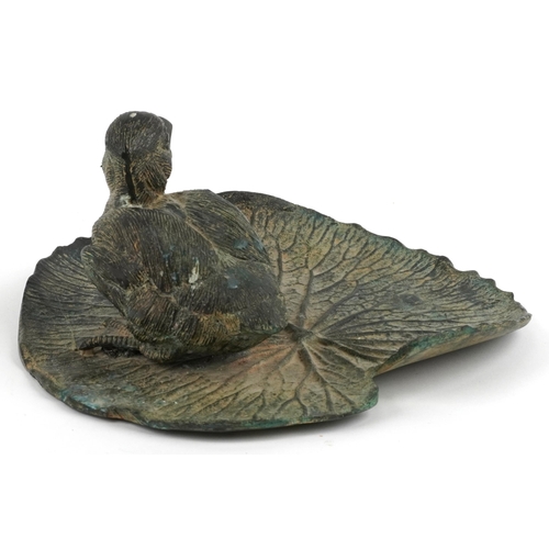 483 - Verdigris patinated bronze sculpture of a duckling on lily pad, 23cm in length