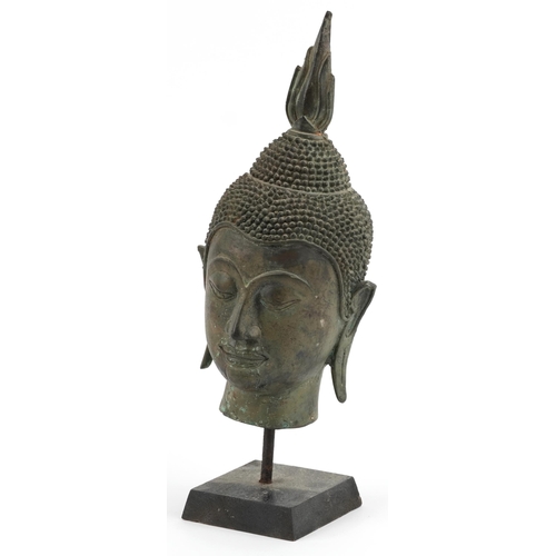 2732 - Chino Tibetan patinated bronze Buddha head on stand, 33.5cm high