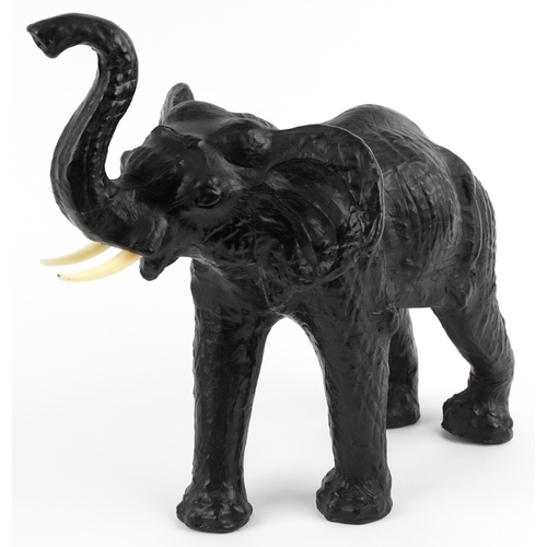 479 - Manner of Liberty & Co, large leather covered  elephant, 49cm in length