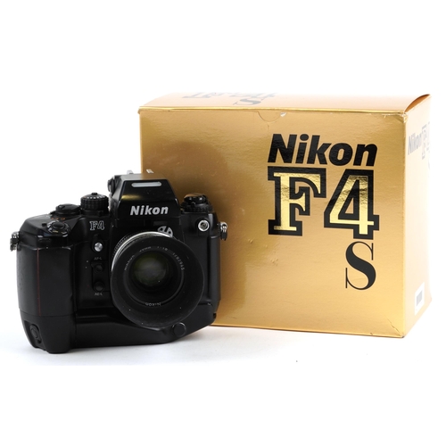 1051 - Nikon F4 camera with 50mm 1:1.8 lens, battery pack and box