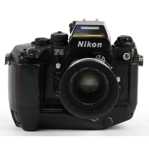 1051 - Nikon F4 camera with 50mm 1:1.8 lens, battery pack and box