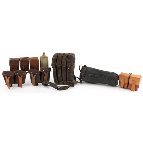 1405 - Militaria including leather ammunition cases, the largest 25.5cm high