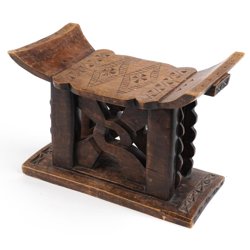 413 - African tribal interest hardwood seat in the form of a headrest, 31cm H x 43.5cm W x 19cm D