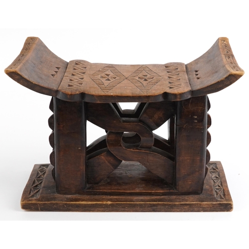 413 - African tribal interest hardwood seat in the form of a headrest, 31cm H x 43.5cm W x 19cm D