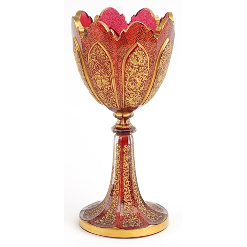 351 - Attributed to Moser, large 19th century Bohemian ruby glass goblet finely gilded with flowers amongs... 