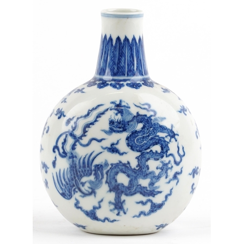 525 - Chinese blue and white porcelain moon flask hand painted with stylised roundels of dragons chasing a... 