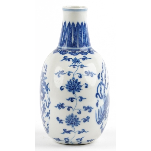 525 - Chinese blue and white porcelain moon flask hand painted with stylised roundels of dragons chasing a... 