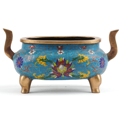 141 - Chinese patinated bronze cloisonne four footed censer with twin handles enamelled with flower heads ... 