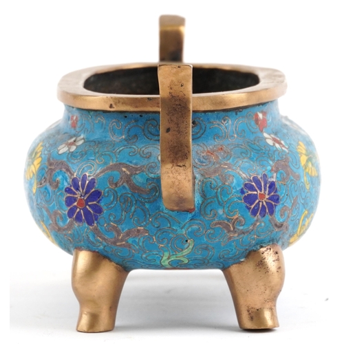 141 - Chinese patinated bronze cloisonne four footed censer with twin handles enamelled with flower heads ... 