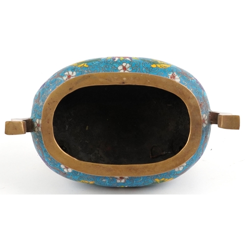 141 - Chinese patinated bronze cloisonne four footed censer with twin handles enamelled with flower heads ... 