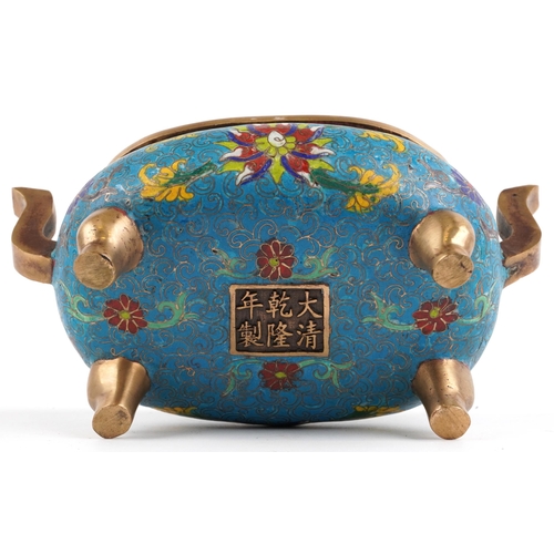 141 - Chinese patinated bronze cloisonne four footed censer with twin handles enamelled with flower heads ... 