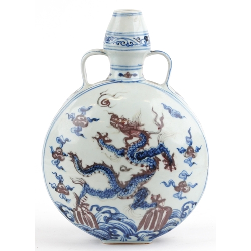 2729 - Chinese blue and white with iron red porcelain moon flask with twin handles, hand painted with two d... 