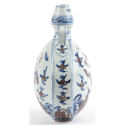 2729 - Chinese blue and white with iron red porcelain moon flask with twin handles, hand painted with two d... 