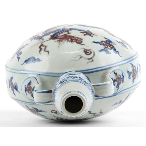 2729 - Chinese blue and white with iron red porcelain moon flask with twin handles, hand painted with two d... 