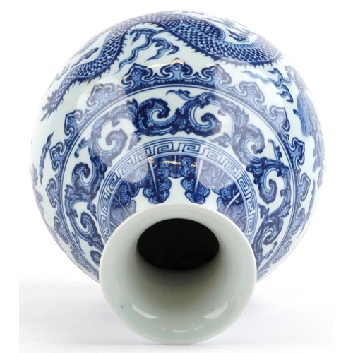 302 - Chinese blue and white porcelain vase hand painted with dragons chasing the flaming pearl amongst cl... 